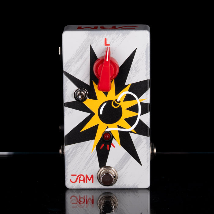 Guitar effects pedal with a star design on a black background