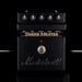 Marshall Shred Master guitar effects pedal with control knobs on a black background