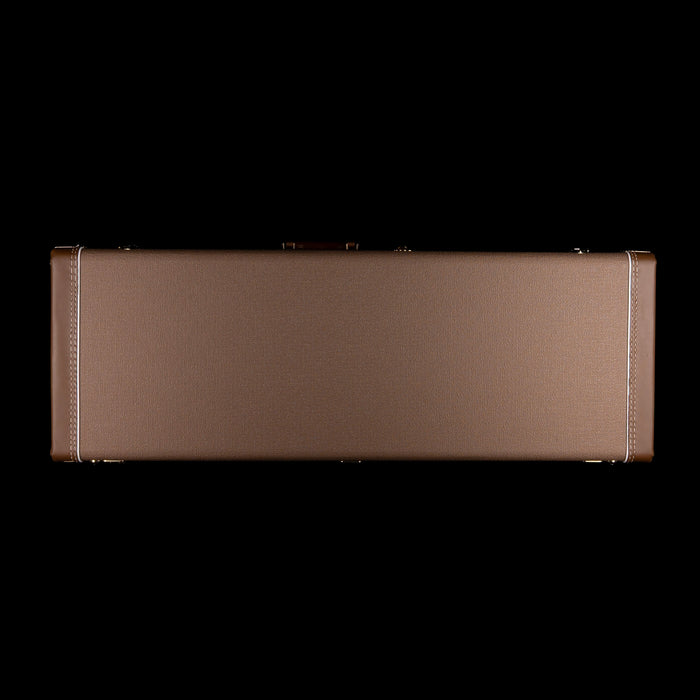 Brown guitar case on a white background