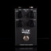 Black guitar effects pedal with 'The Dude' branding on a black background