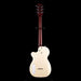 White electric guitar with a dark brown neck on a black background