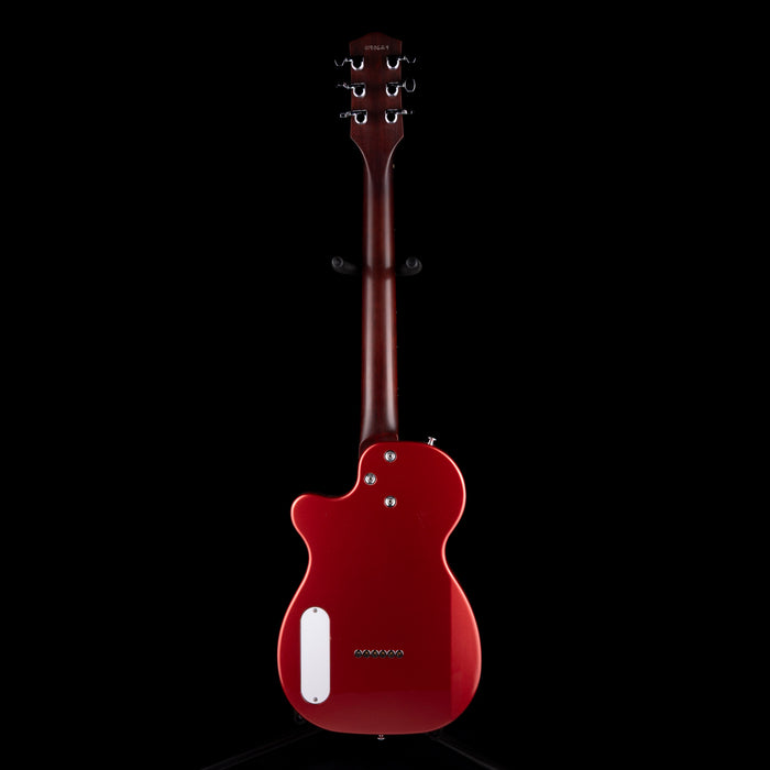 Red electric guitar on a black background