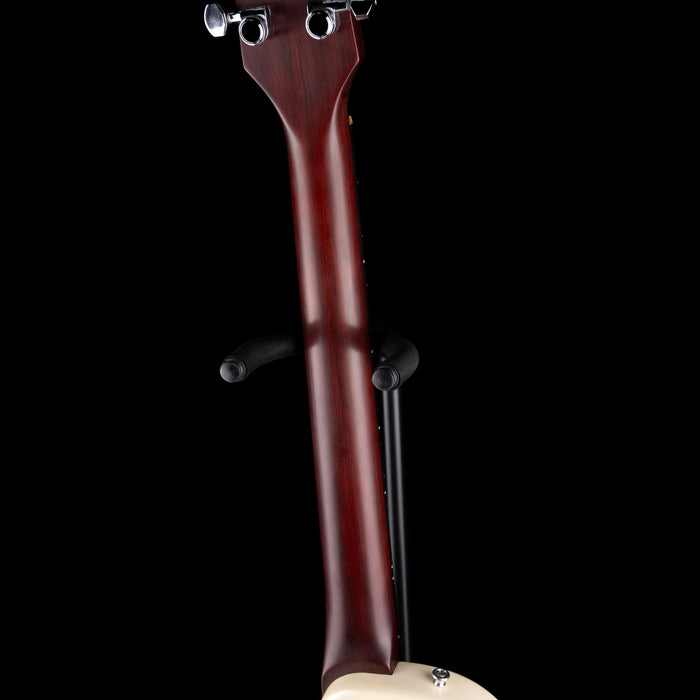 Close-up of a guitar neck on a black background