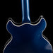 Close-up of a blue electric guitar body on a black background