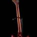 Close-up of a violin's back and neck on a black background