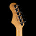 Close-up of a guitar headstock with 'Oshiro' branding on a black background