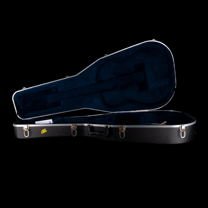 Black guitar case with a visible brand logo on a black background