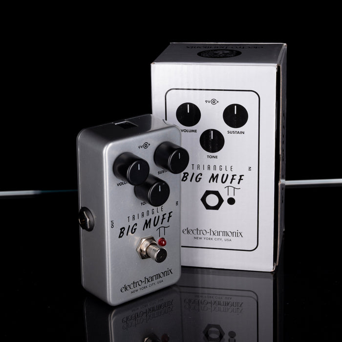Electro-Harmonix Triangle Big Muff guitar effects pedal on a reflective surface with a black background