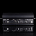 Black audio amplifier with various input and output ports on a black background