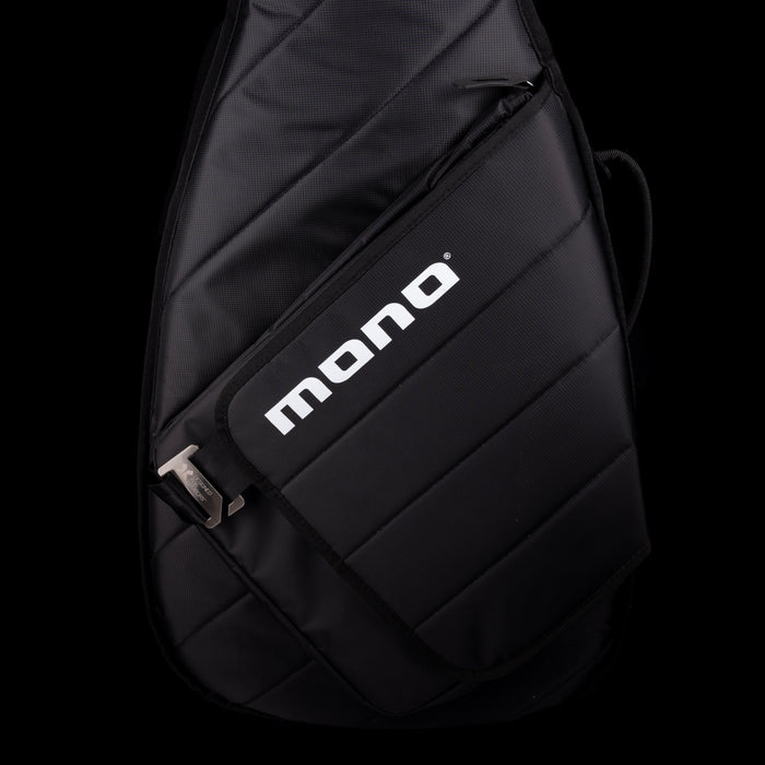 Black sling bag with 'mono' logo on a black background