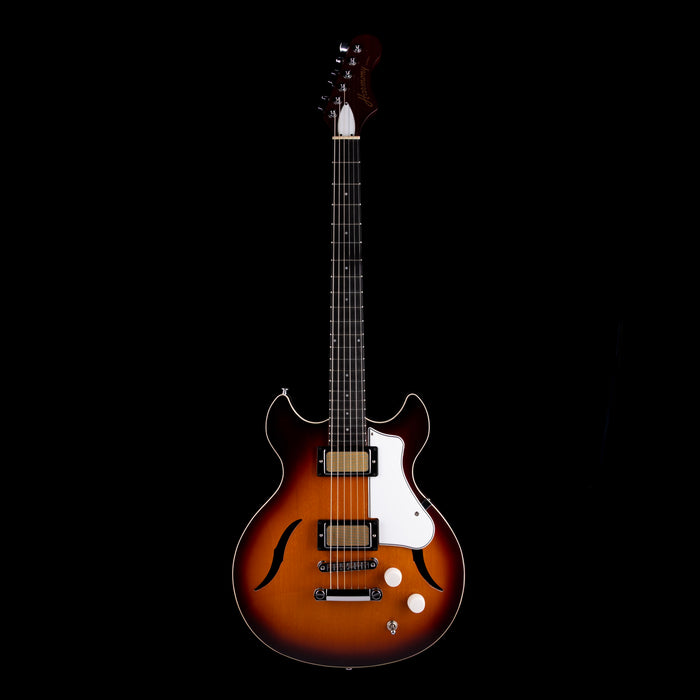 Electric guitar with a sunburst finish on a black background