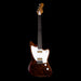 Electric guitar with a wooden body and neck on a black background