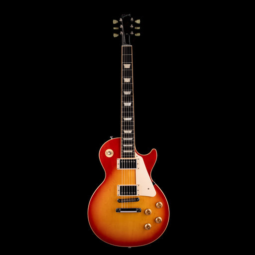 Electric guitar with a sunburst finish on a black background