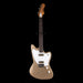 Beige electric guitar with a white pickguard on a black background