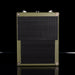 Green guitar amplifier with black mesh on a reflective surface