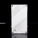 Metallic rectangular object with textured surface on a black background