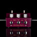 Guitar effects pedal with multiple jacks on a reflective surface