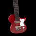 Red electric guitar on a black background