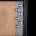 Close-up of a vintage amplifier with control knobs and 'Silverstone' branding.