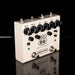 Guitar effects pedal with 'Route 66' and 'TrueTone' branding on a reflective surface.