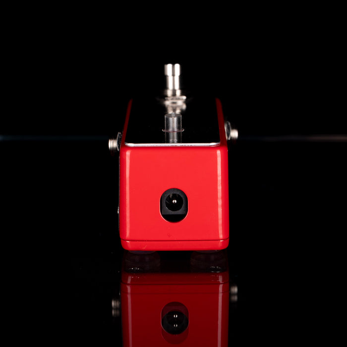 Red electronic device with a black background