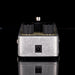 Guitar effects pedal with knobs and a jack on a black background