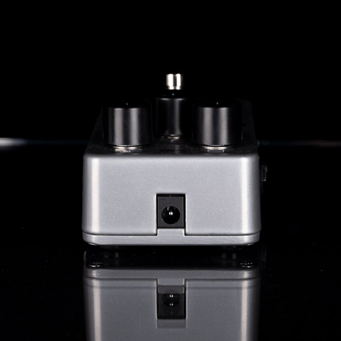 Small electronic device with knobs on a black background
