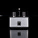 Small electronic device with knobs on a black background