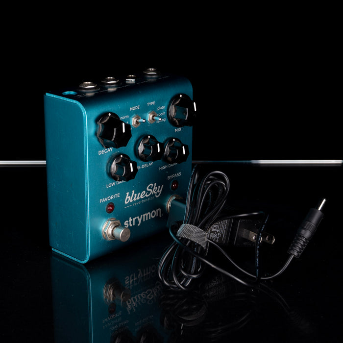 Blue Sky stymon guitar effects pedal with power cord on a black background