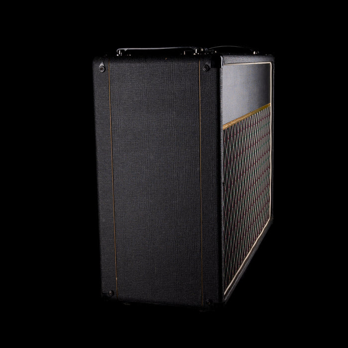 Guitar amplifier with grille and text on a black background