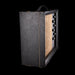 Vintage-style guitar amplifier with a textured black front panel on a white background