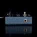 Blue guitar effects pedal with visible branding on a black background