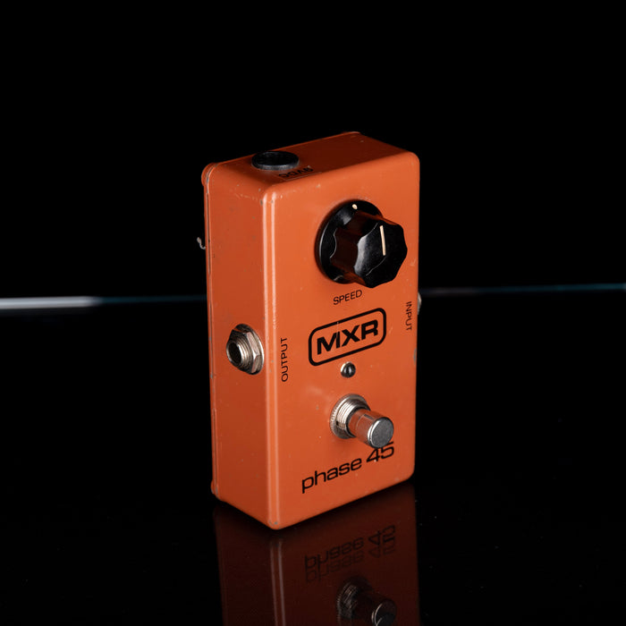 Orange MXR Phase 45 guitar effects pedal on a black background