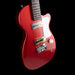 Red electric guitar on a black background