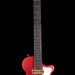 Red electric guitar on a black background