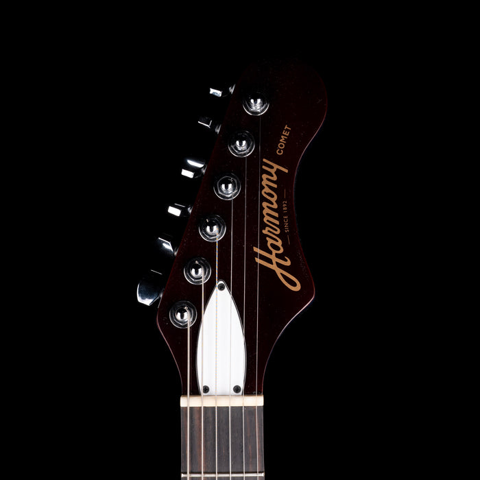 Guitar headstock with 'Harmony' branding on a black background