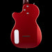 Red electric guitar body with a black background