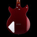 Red electric guitar on a black background