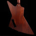 Wooden guitar body on a black background