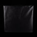 Black leather-bound book on a black background